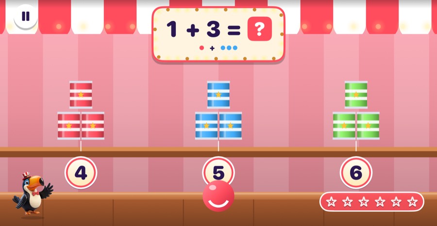 Can Knockdown booth in Mathing: Throw a ball at the can pyramid with the right answer and watch it crash down.